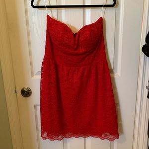 Red lace strapless dress.